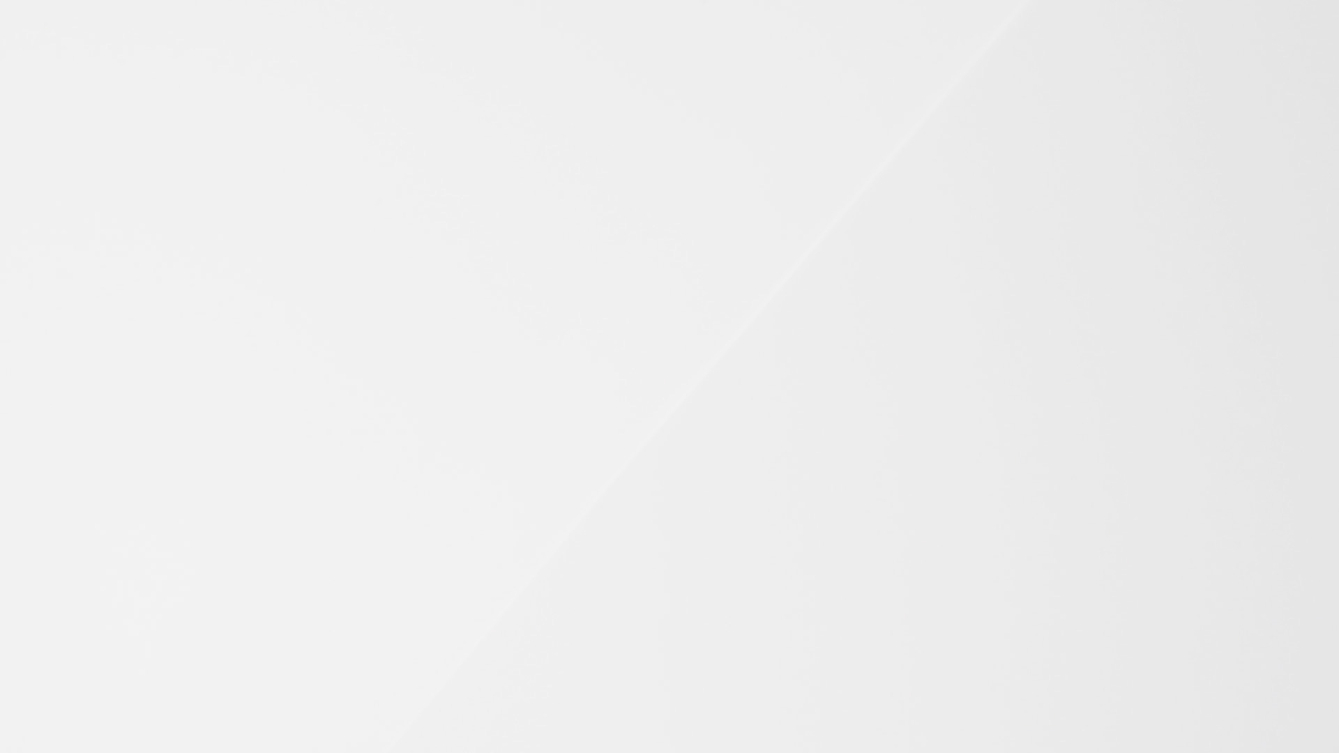 close up of white textured plasterboard wall with light spill from a nearby window